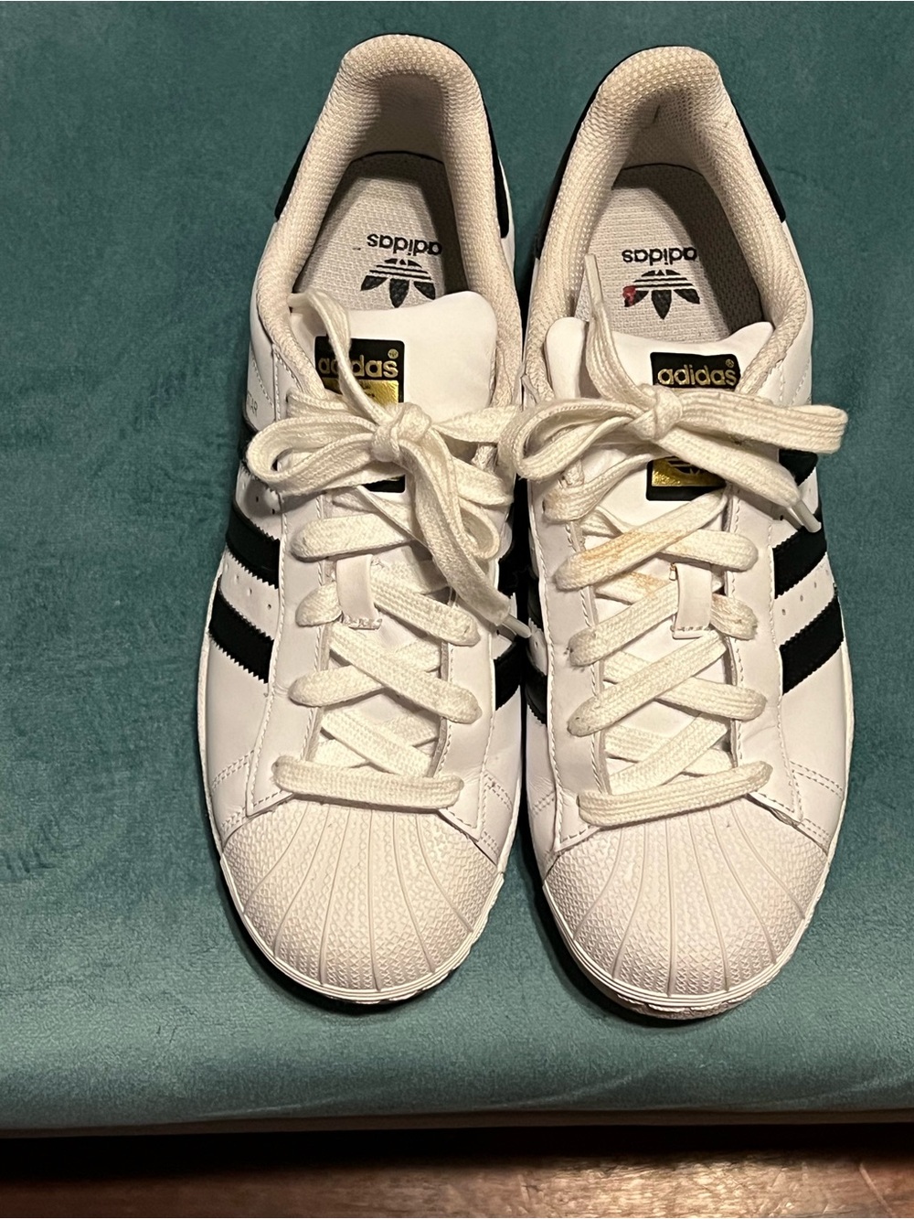adidas White Sneakers with Black Stripes and Gold Tongue Logo